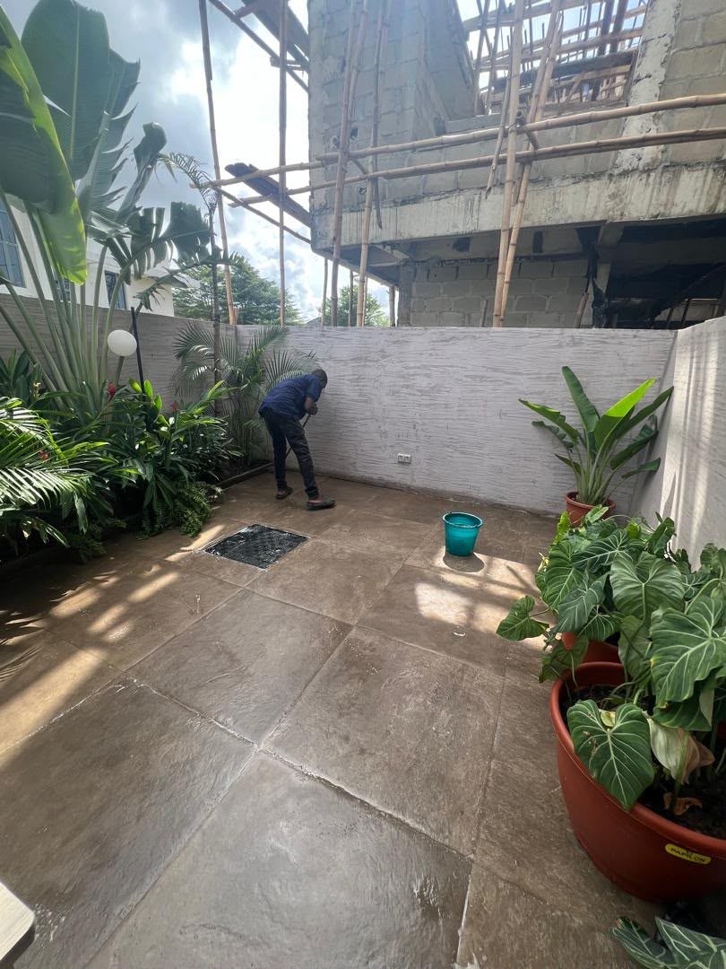 Outdoor courtyard being scrubbed and washed