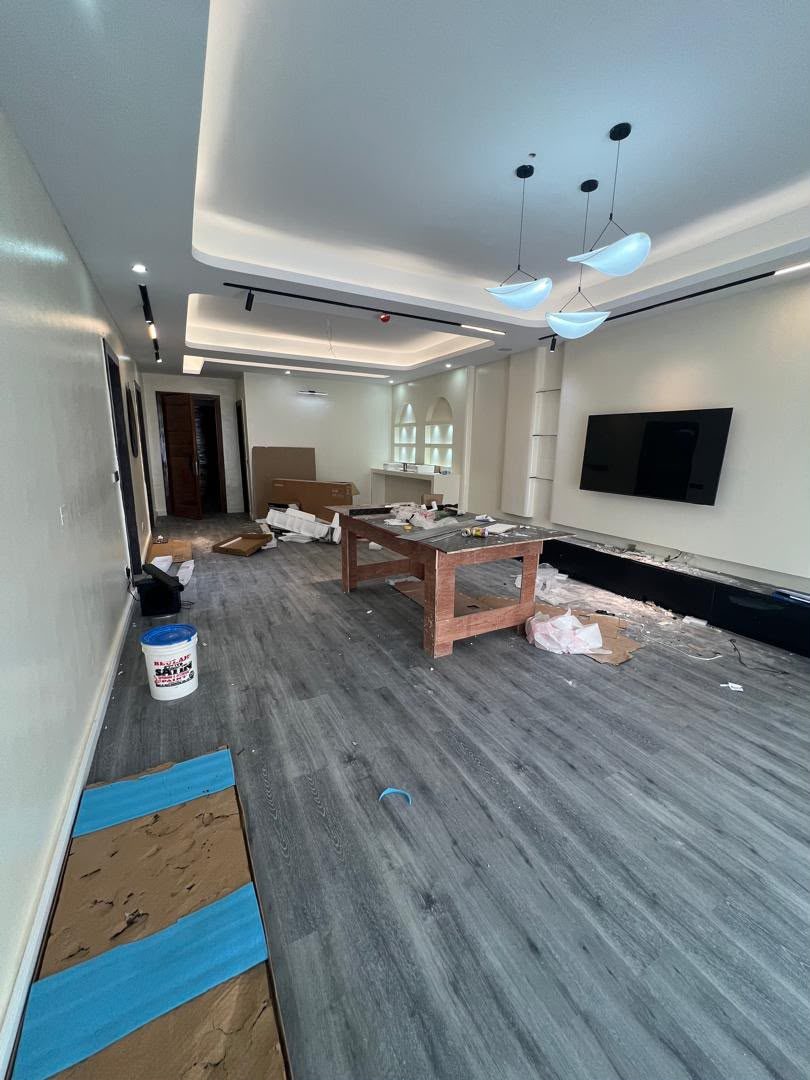 Lounge under construction with debris and materials